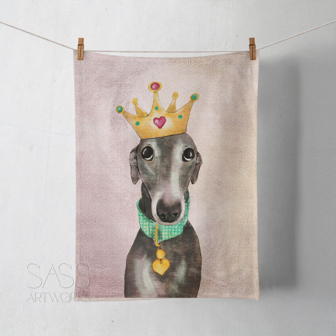 Tea towel with a greyhound or whippet  wearing a crown and green collar with a gold heart.