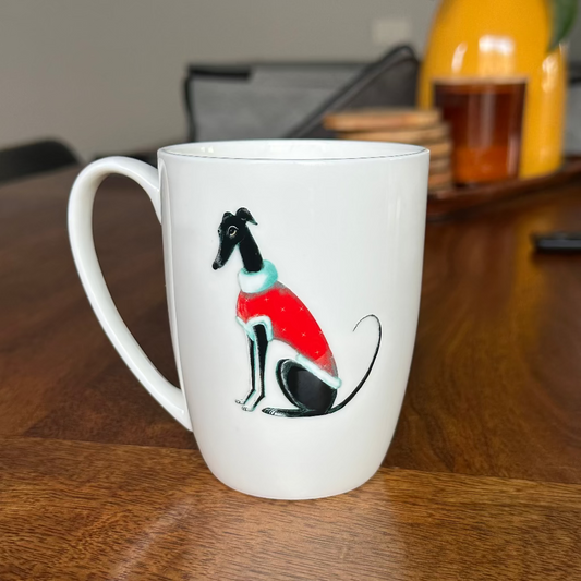 White mug with a dog illustration on a wooden table