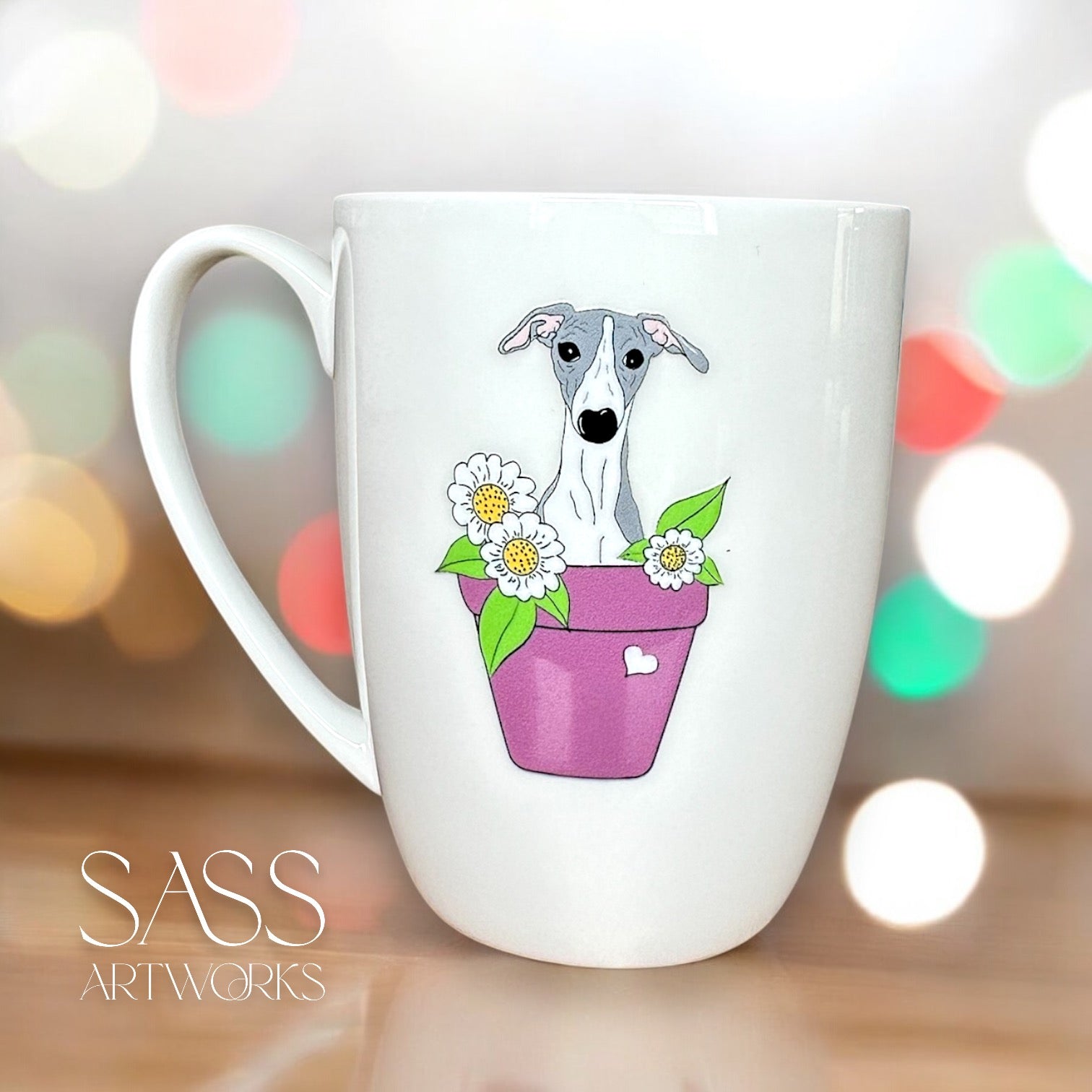 White mug with a dog illustration in a purple pot on a blurred background, featuring 'SASS Artworks' branding.